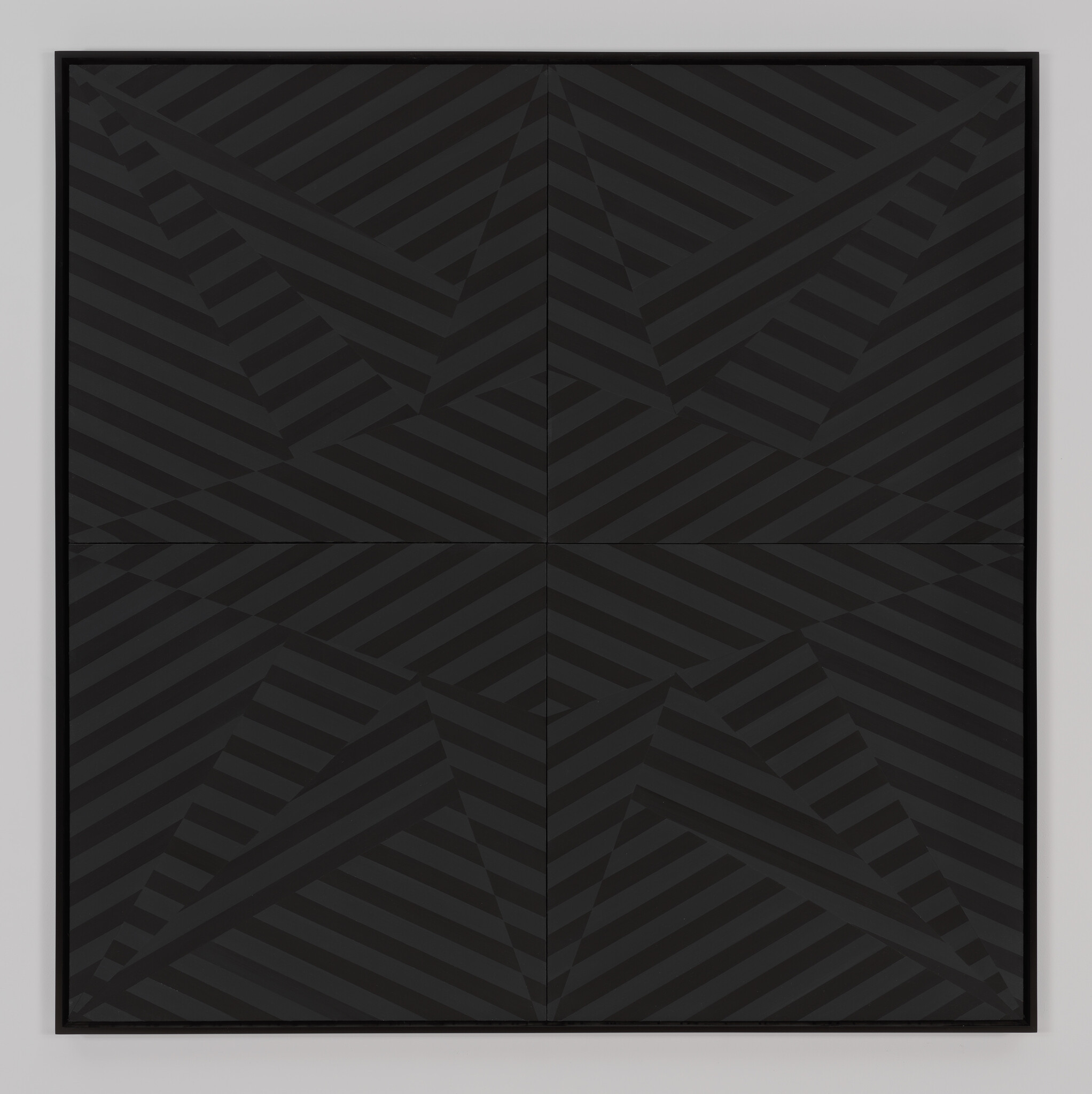 Framed black artwork with diagonal dark stripes forming a geometric star pattern across four panels.