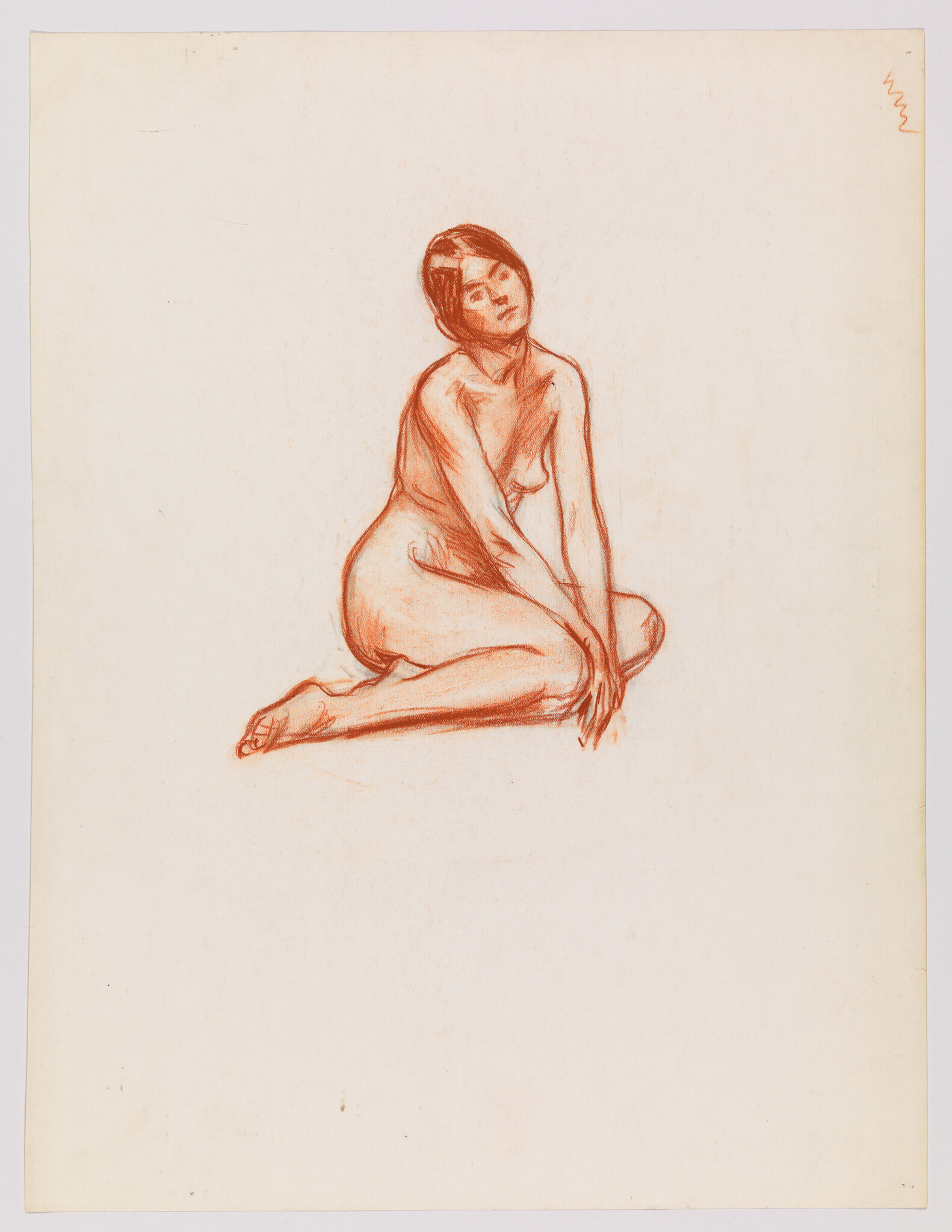 Nude woman sitting on the floor with hands clasped and head tilted slightly upward.