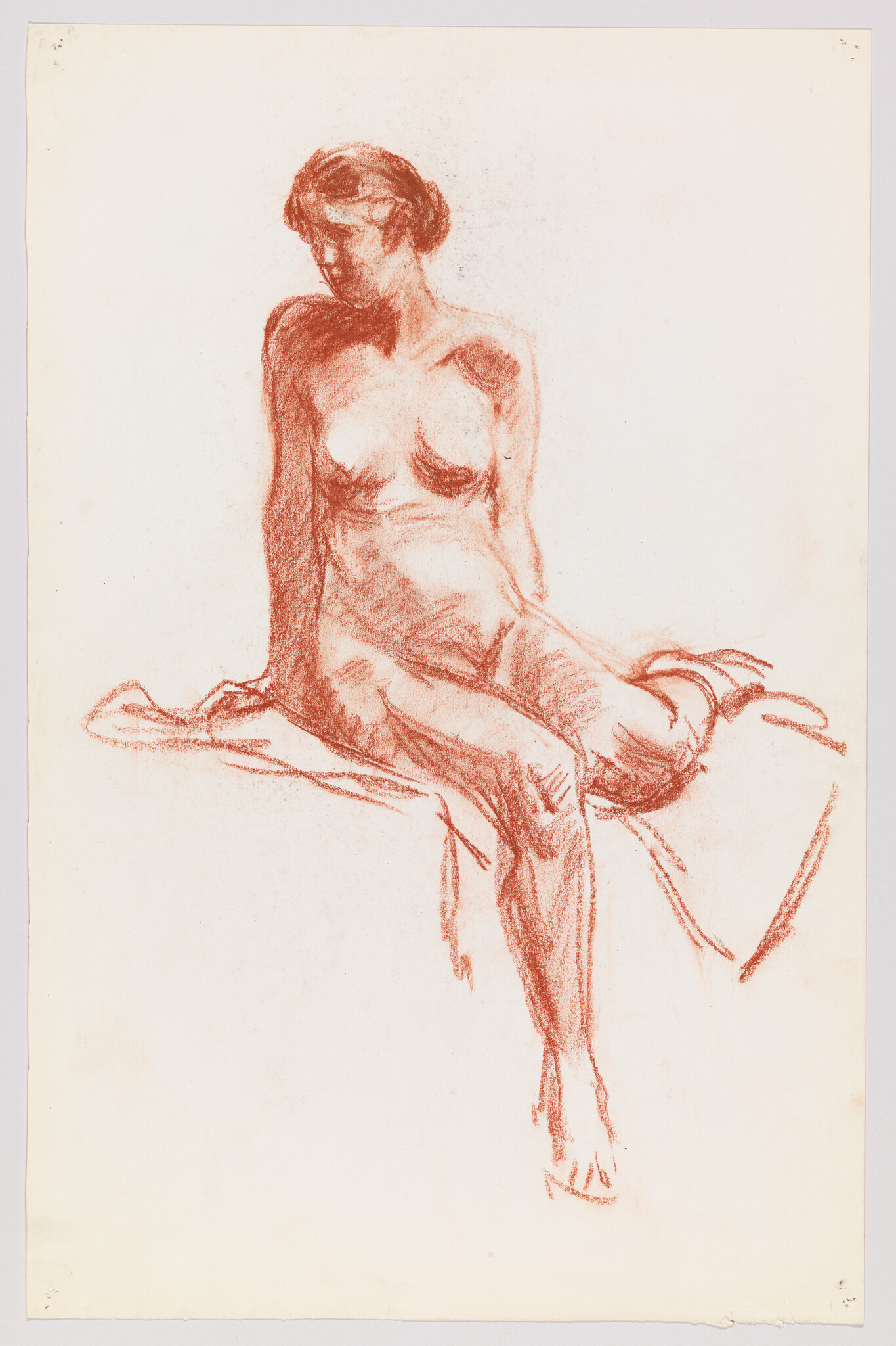 A red chalk sketch of a seated nude woman looking down while resting on draped cloth.