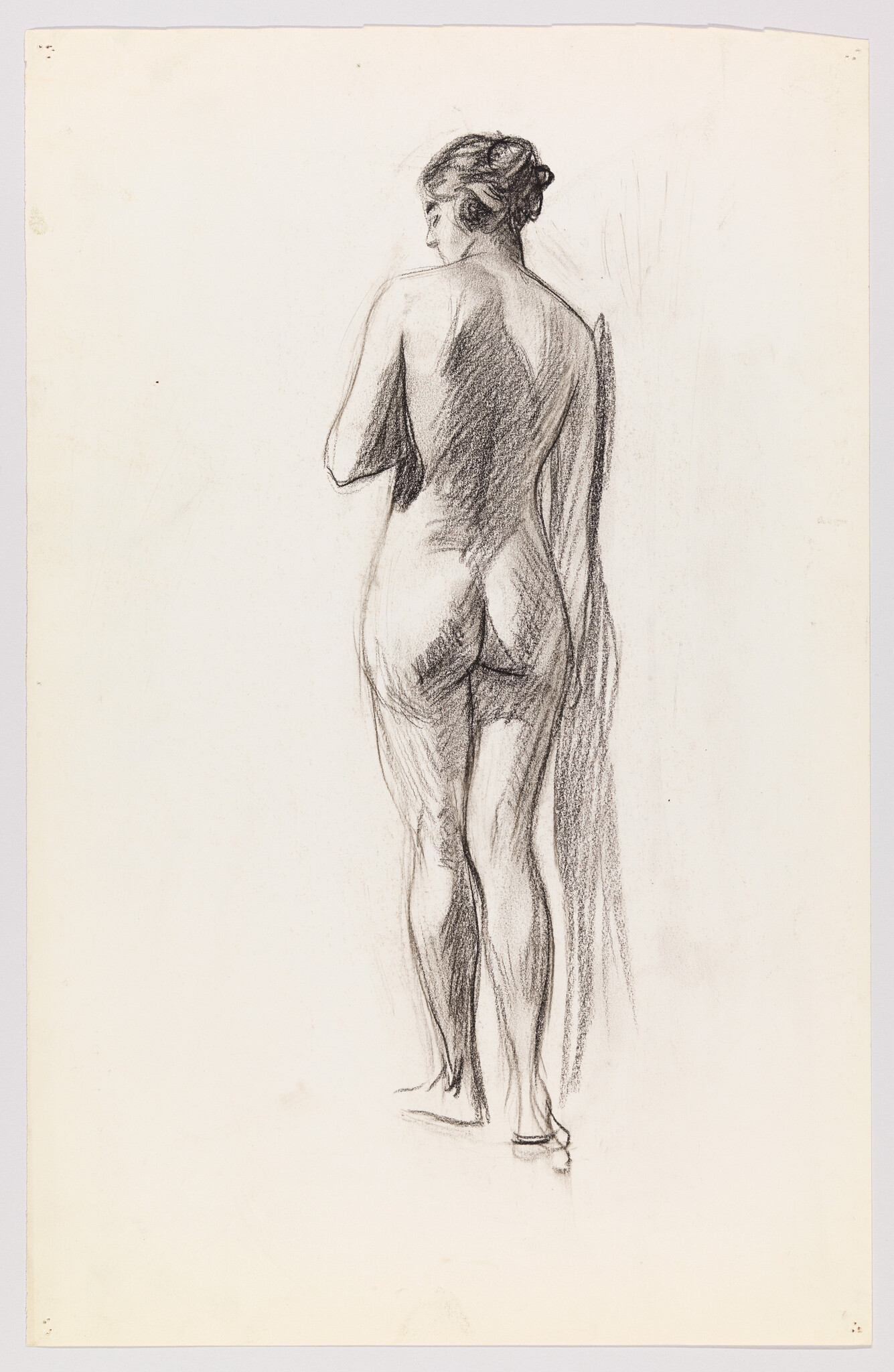 A standing nude woman seen from behind holding a draped cloth against her side.