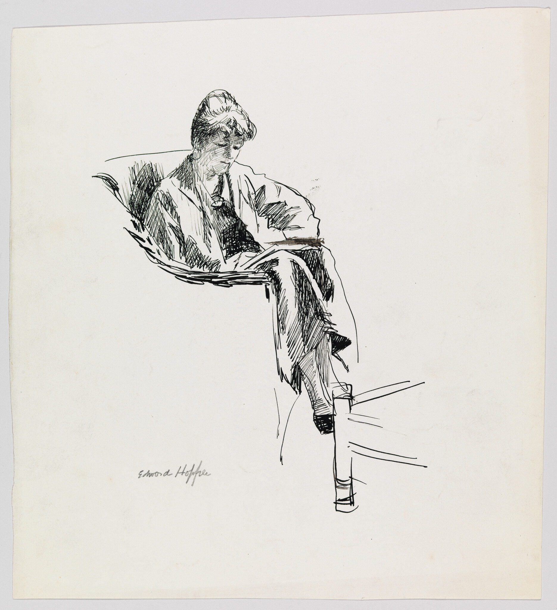 A person sits in a chair with legs crossed, reading or writing on their lap.