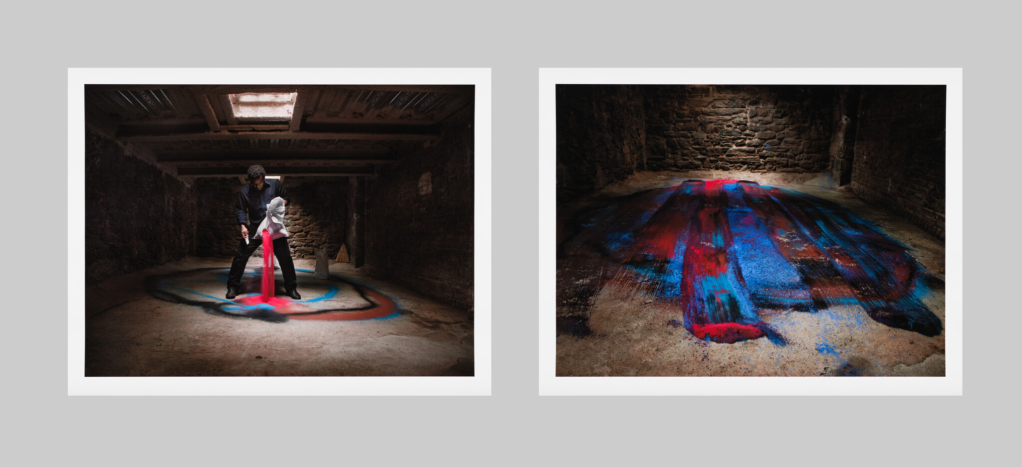 A diptych of two images set in a rustic room with a skylight. On the left, a person pours red paint onto a sculpture wrapped in white fabric, surrounded by a circular pattern of colorful sand on the floor. On the right, the sculpture is absent, leaving a vibrant splash of red, blue, and purple hues on the sandy floor, resembling an abstract painting.