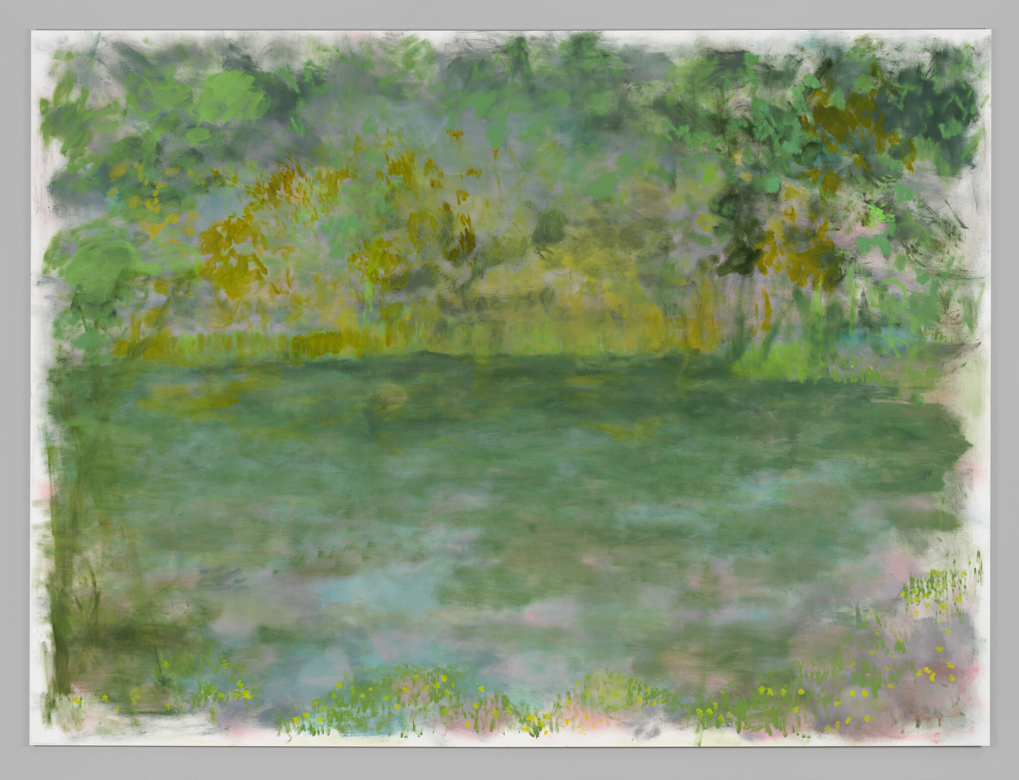 A soft impressionistic green meadow with blurred trees and small yellow flowers along the edges.