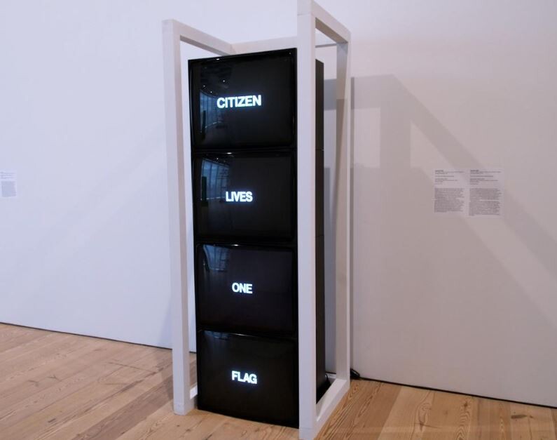 Four stacked screens in a white frame display the words Citizen, Lives, One, Flag.