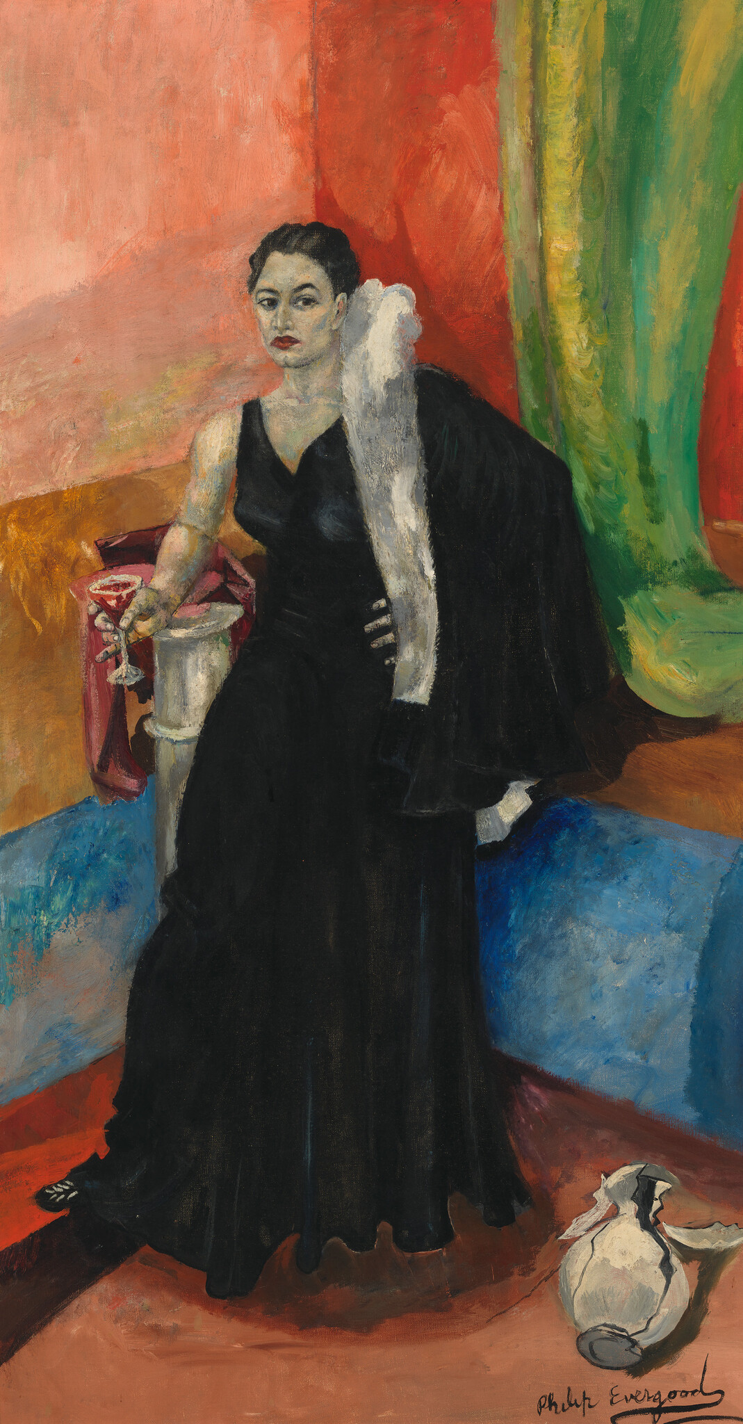 A woman in a black evening gown holds a cocktail glass while standing beside a broken vase.