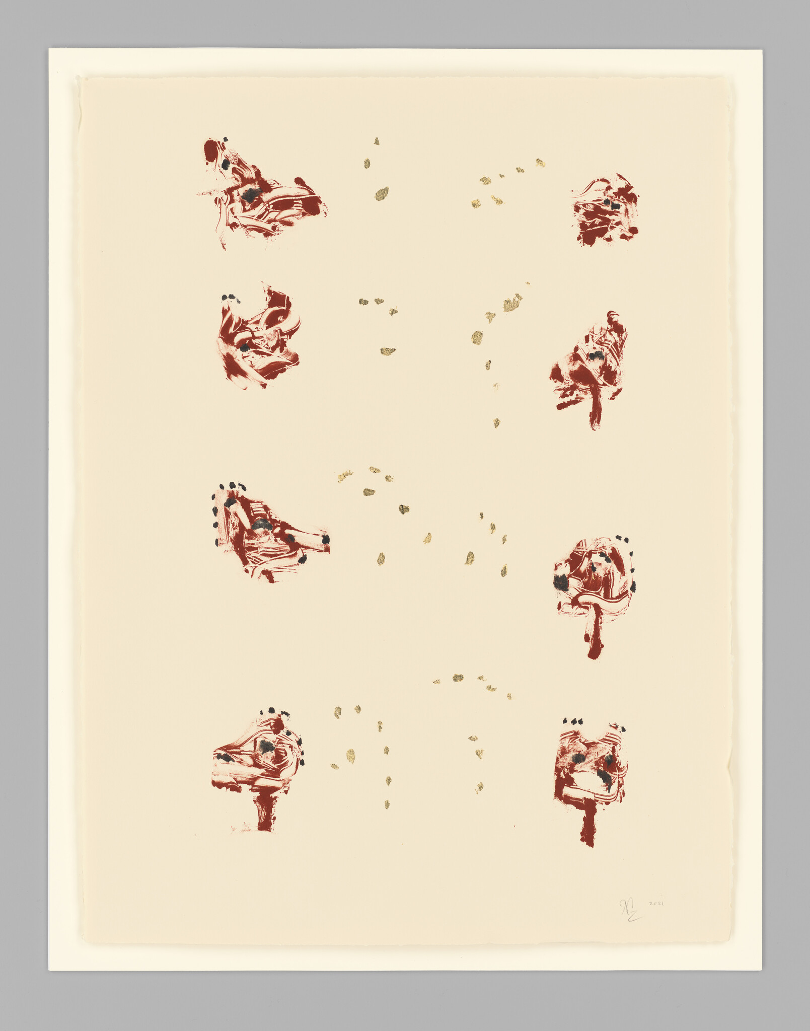 Eight abstract red floral shapes and scattered gold flecks arranged on a cream background.