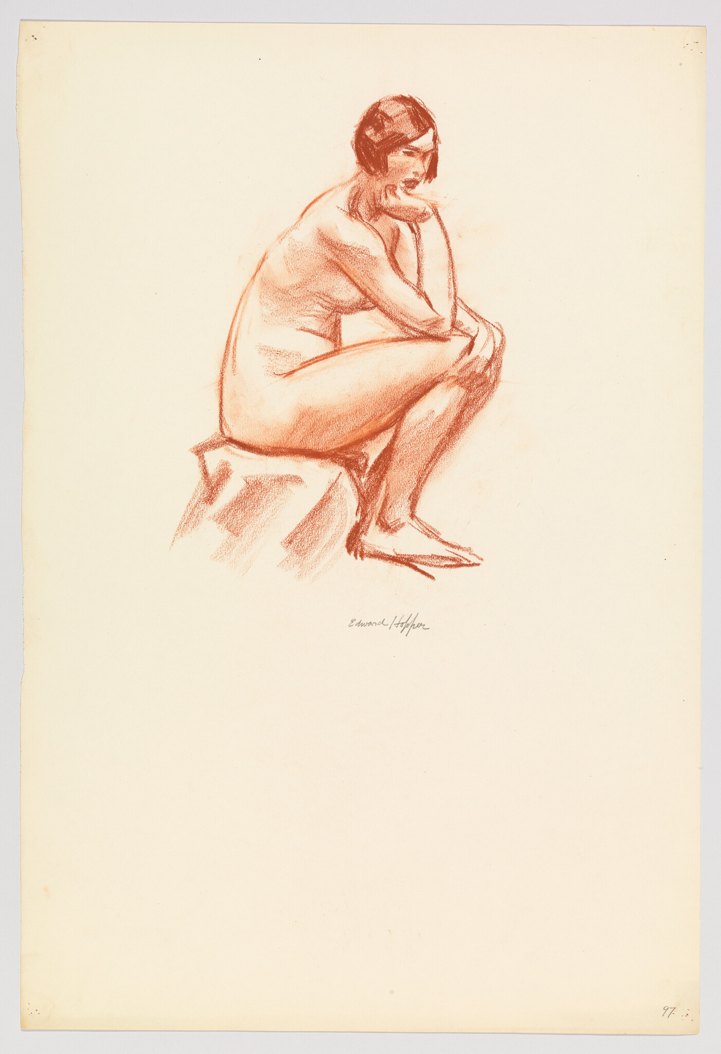 Nude woman sits on a block, leaning forward with her chin resting on her hand.