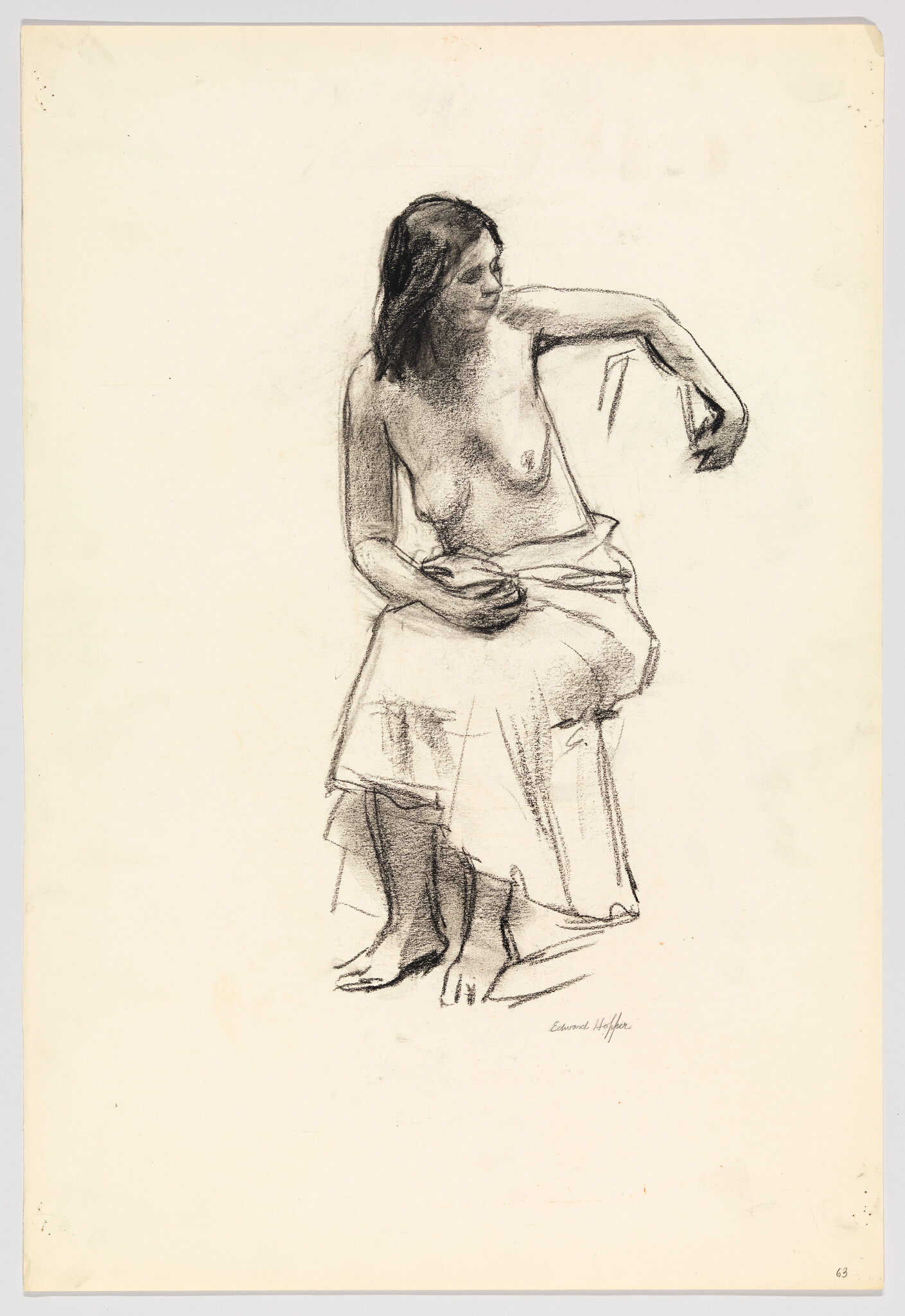 A seated, partially draped woman looks right while lifting her arm in a charcoal sketch.