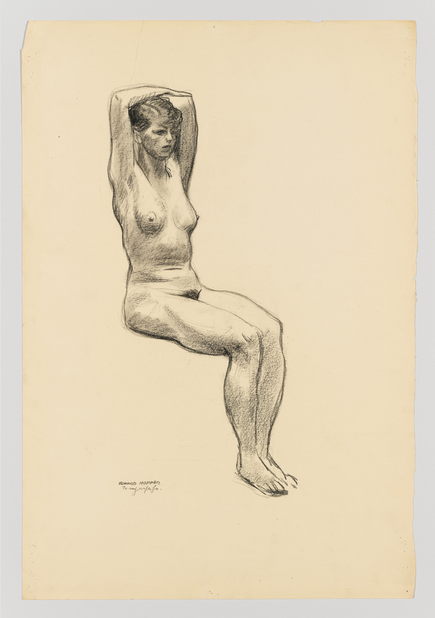 A charcoal sketch of a seated nude woman with arms raised behind her head.