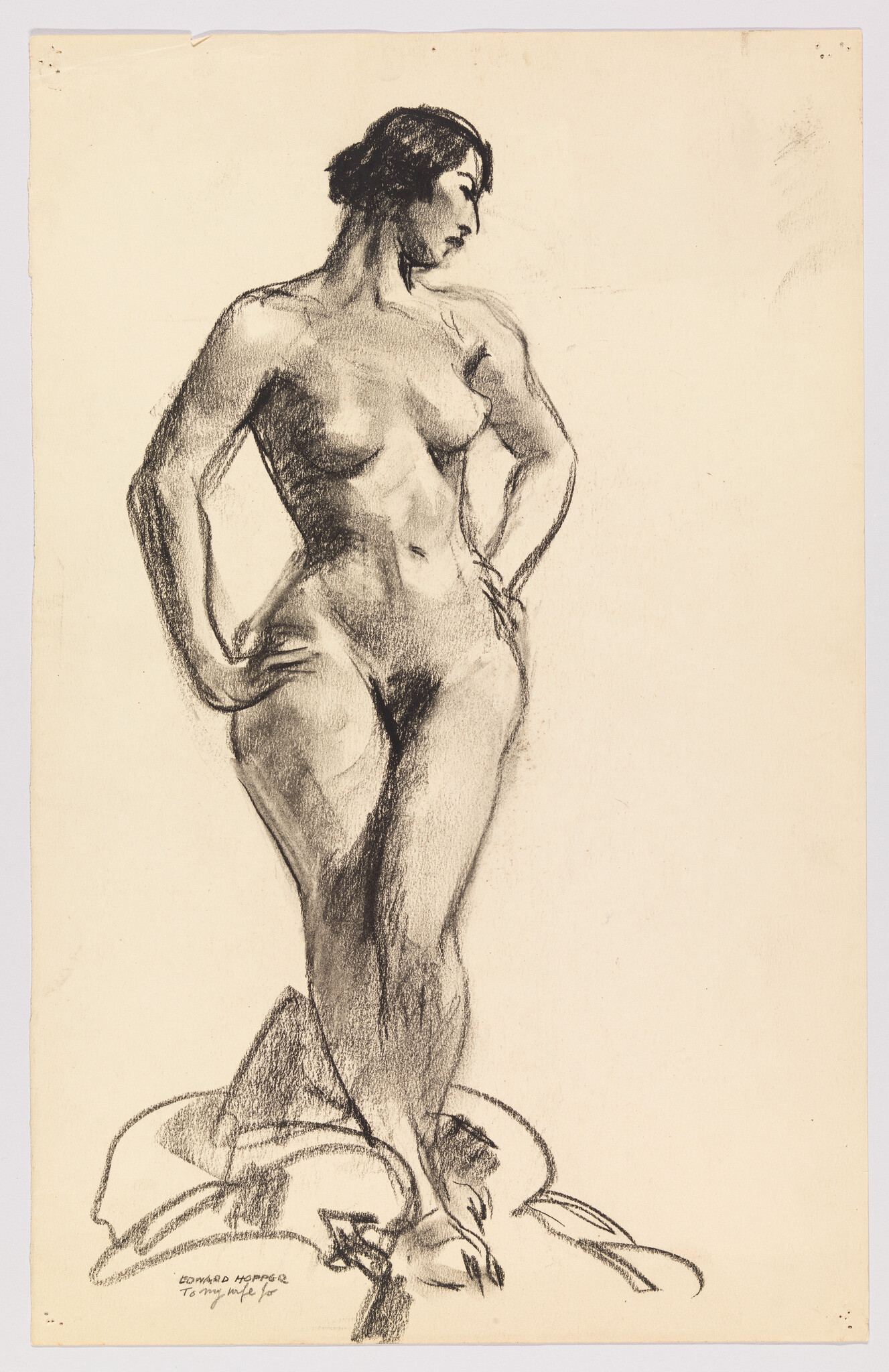 Standing nude woman in a contrapposto pose with hands on hips, looking to her left.