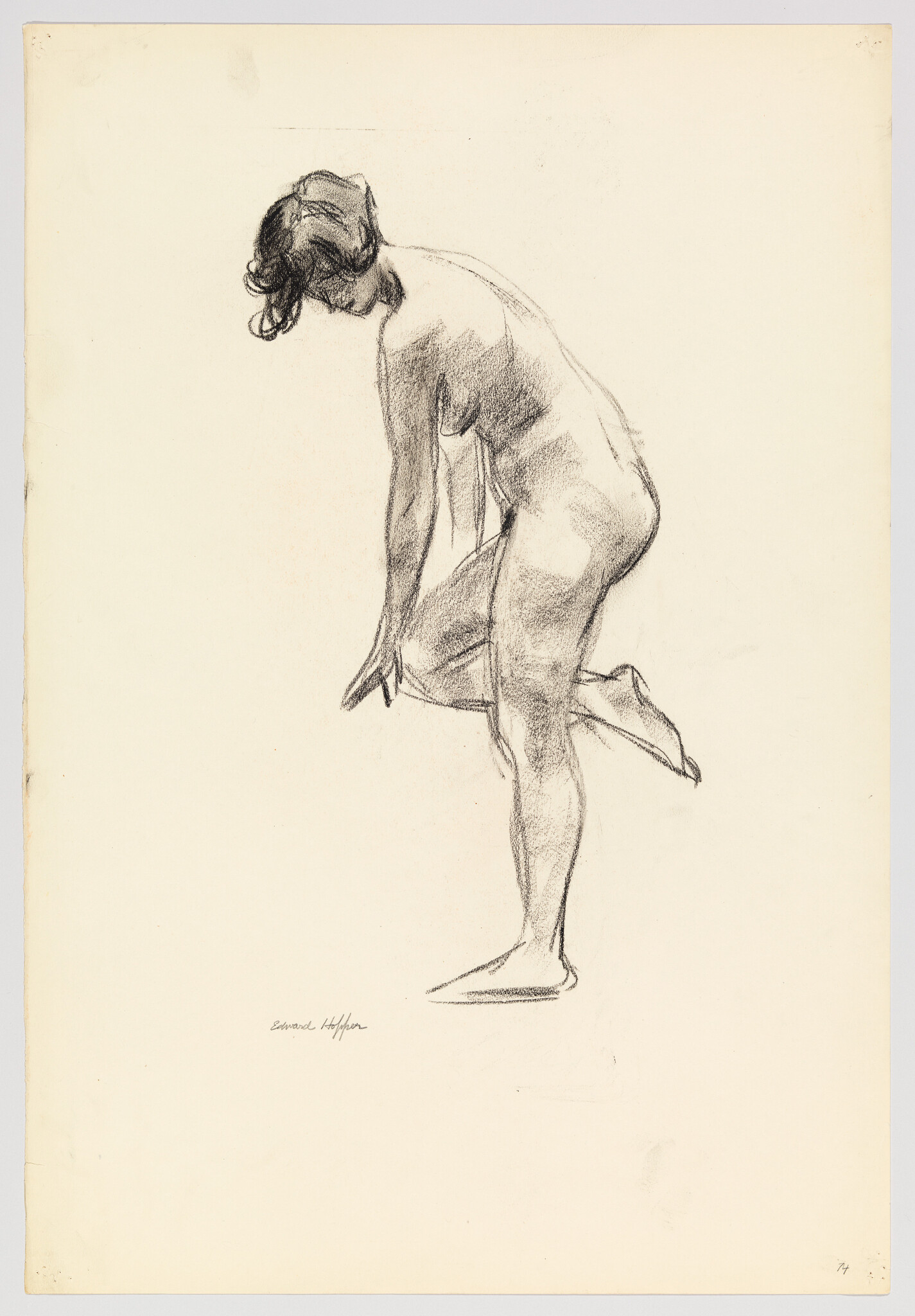 A charcoal sketch of a nude woman balancing on one foot while adjusting her leg.