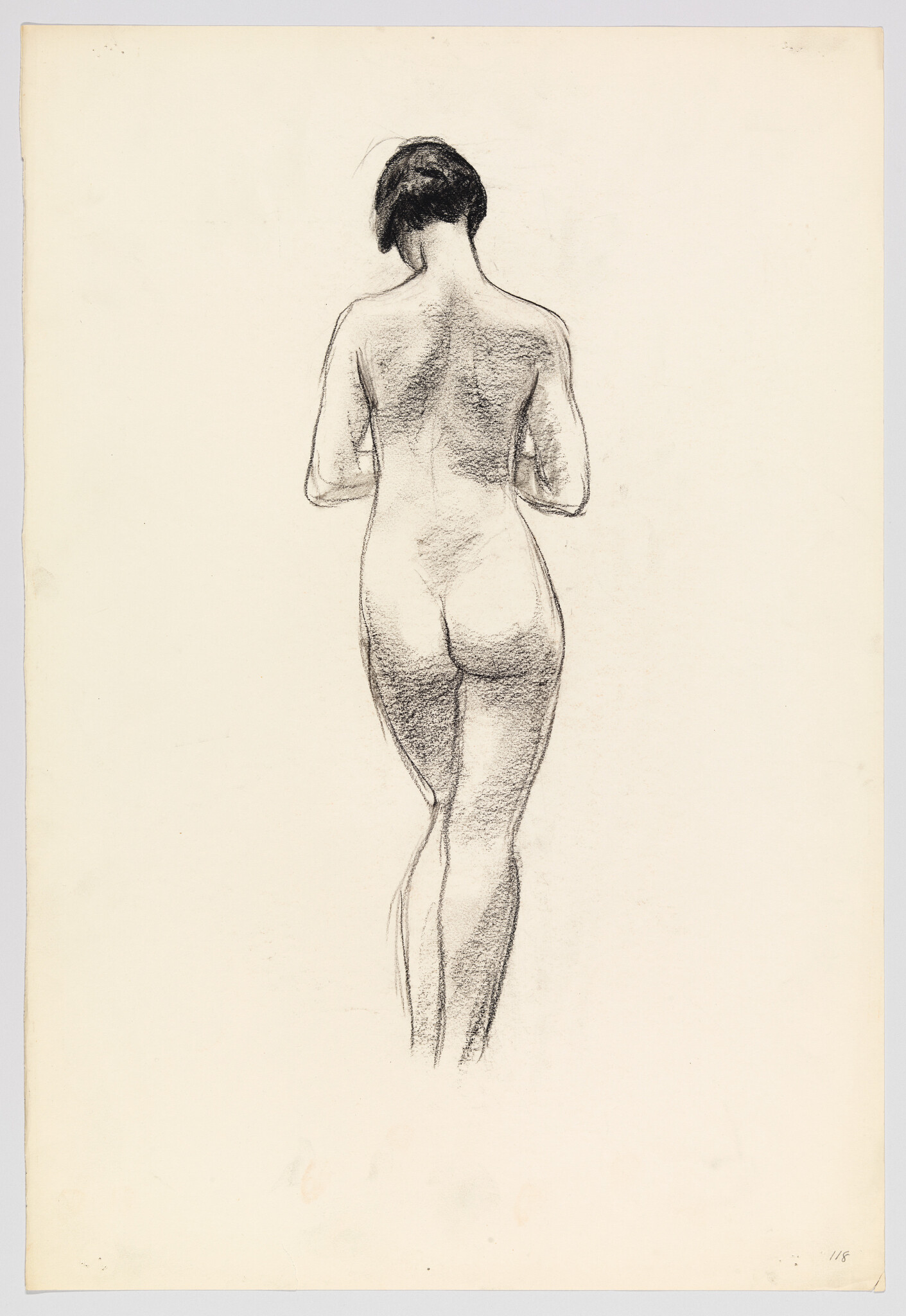 A charcoal sketch of a standing nude woman shown from the back with hands near chest.