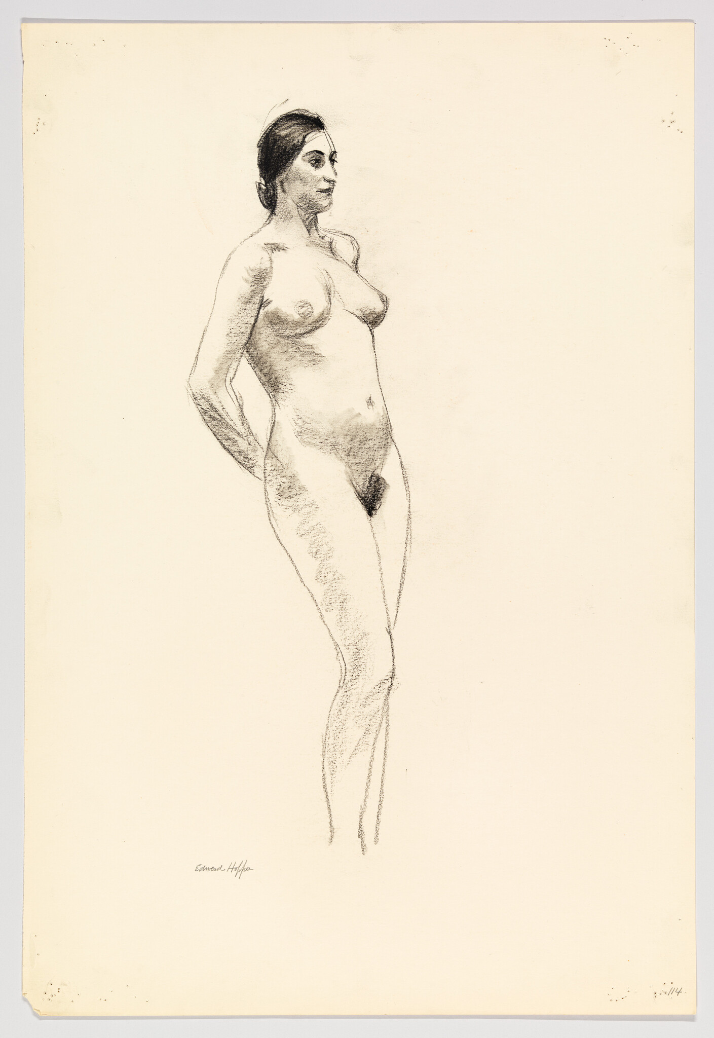 A standing nude woman poses with hands behind her back in a charcoal sketch.