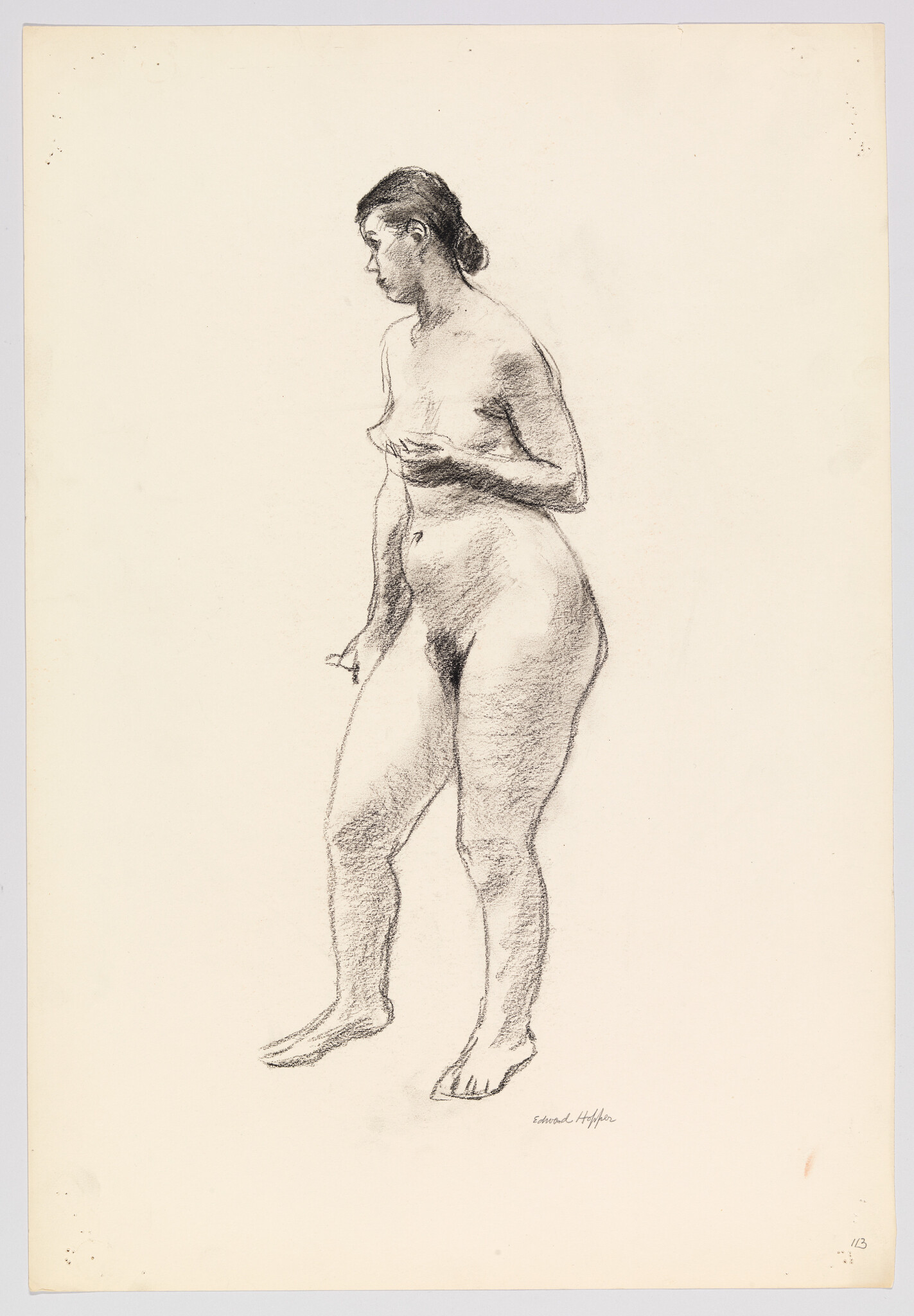 A standing nude woman in a charcoal sketch, holding her chest and looking to the left.
