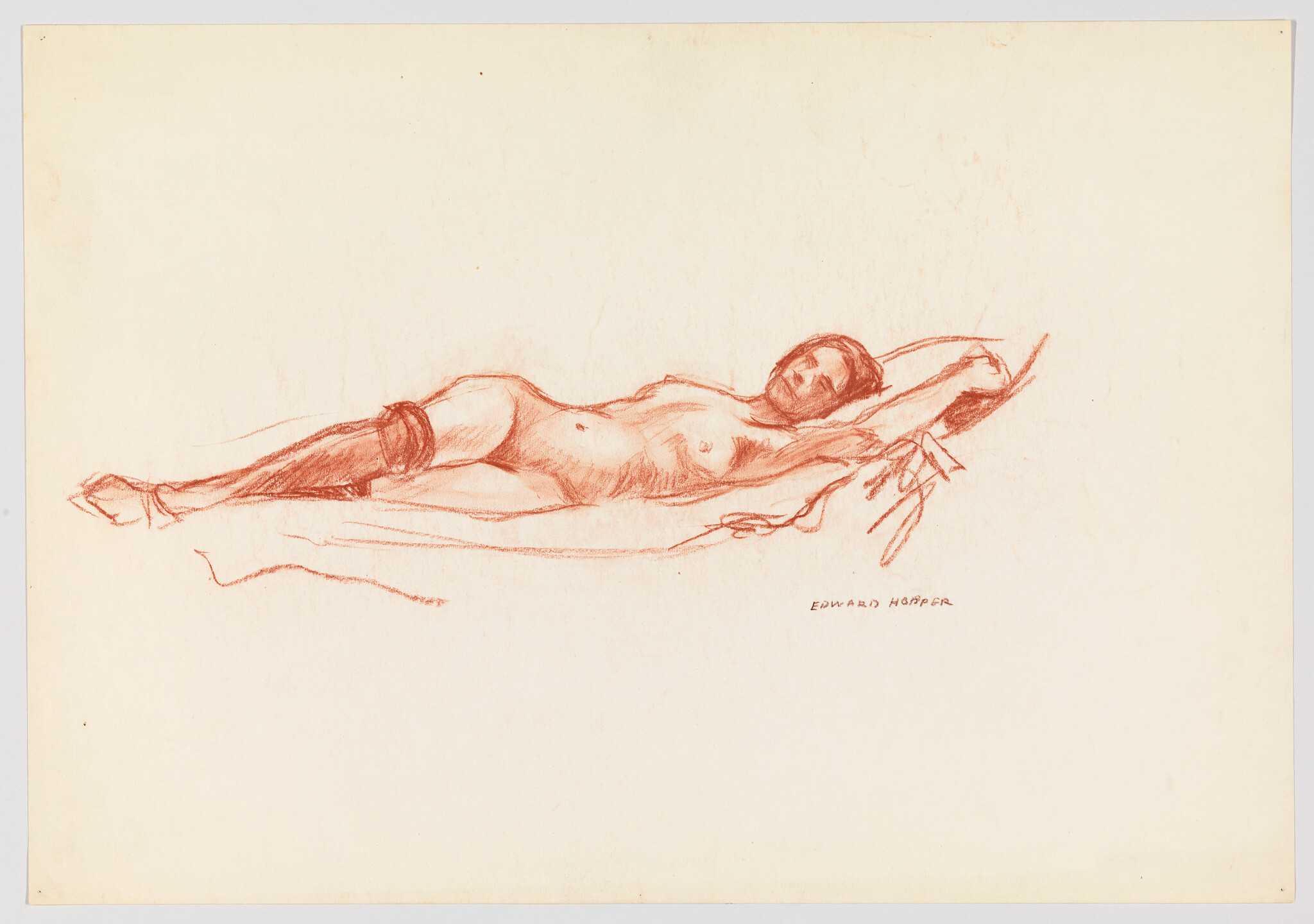 A reclining nude woman stretches her arm behind her head on a simple draped surface.