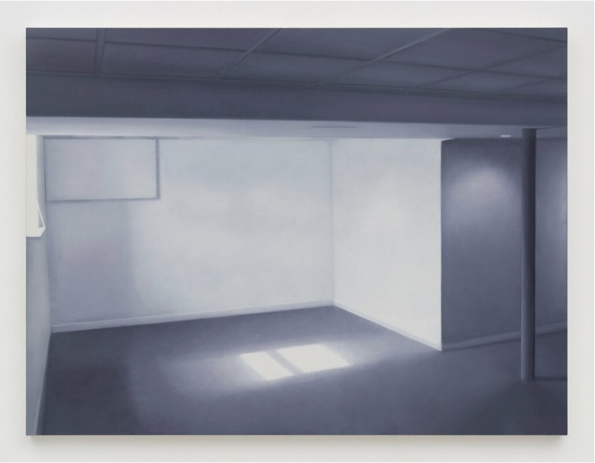 A minimalist painting or photograph of an empty room with white walls, a dark ceiling, and a patch of sunlight on the floor coming from a window not visible in the frame. The room has a column on the right side, and there's a subtle interplay of light and shadow throughout the space.