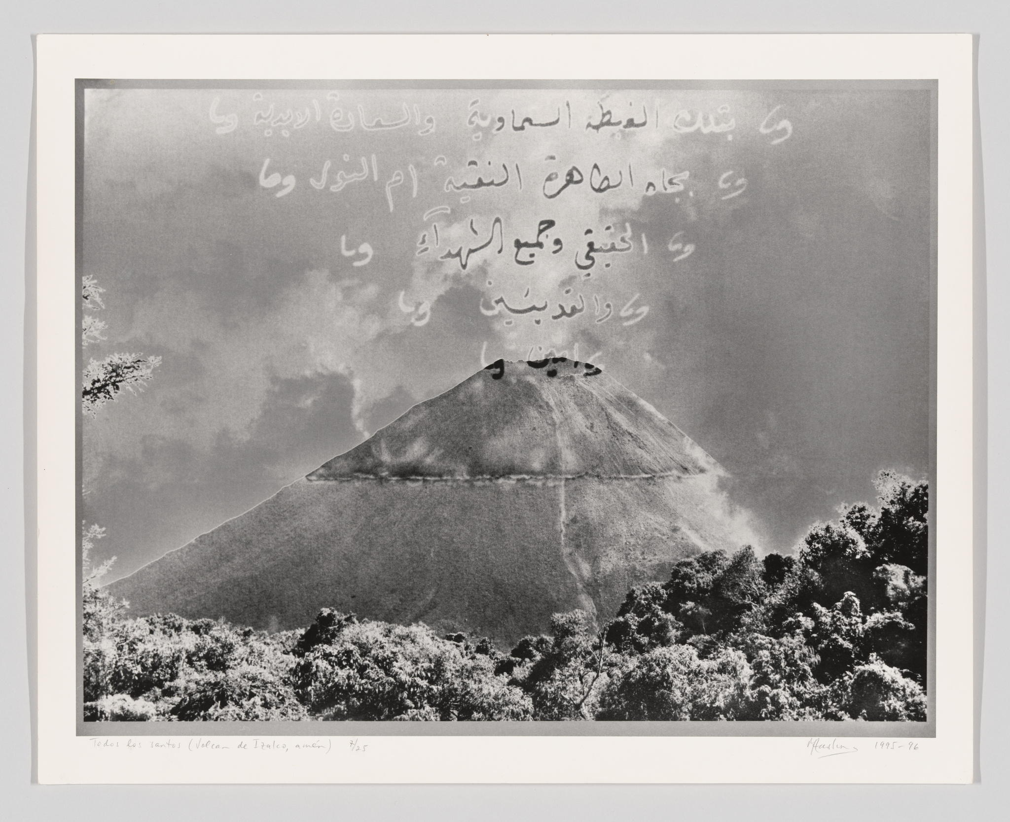 A black and white photo of a volcano from a distance with Arabic writing superimposed across the top.