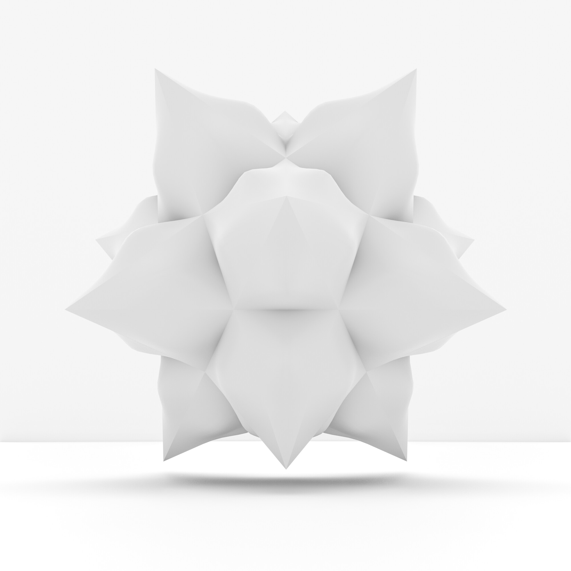 A white, geometric, flower-like sculpture on a seamless white background.
