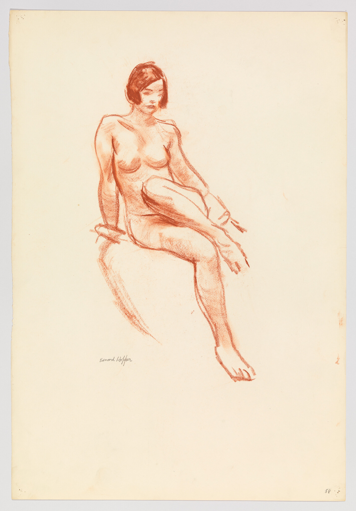 Nude woman seated on a draped surface with one leg crossed and hands supporting her.