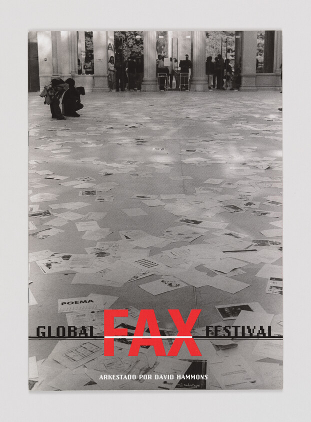 Scattered papers cover a gallery floor with visitors near columns and bold red word "FAX".