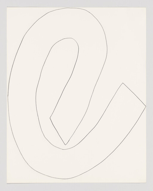 A single thin black line loops in a large abstract shape across a white sheet of paper.