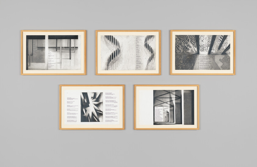 Five framed black and white artworks with abstract architectural designs and visible columns of printed text on each piece.