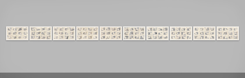 Eleven framed artworks with multiple small sketches are displayed in a row on a white wall.