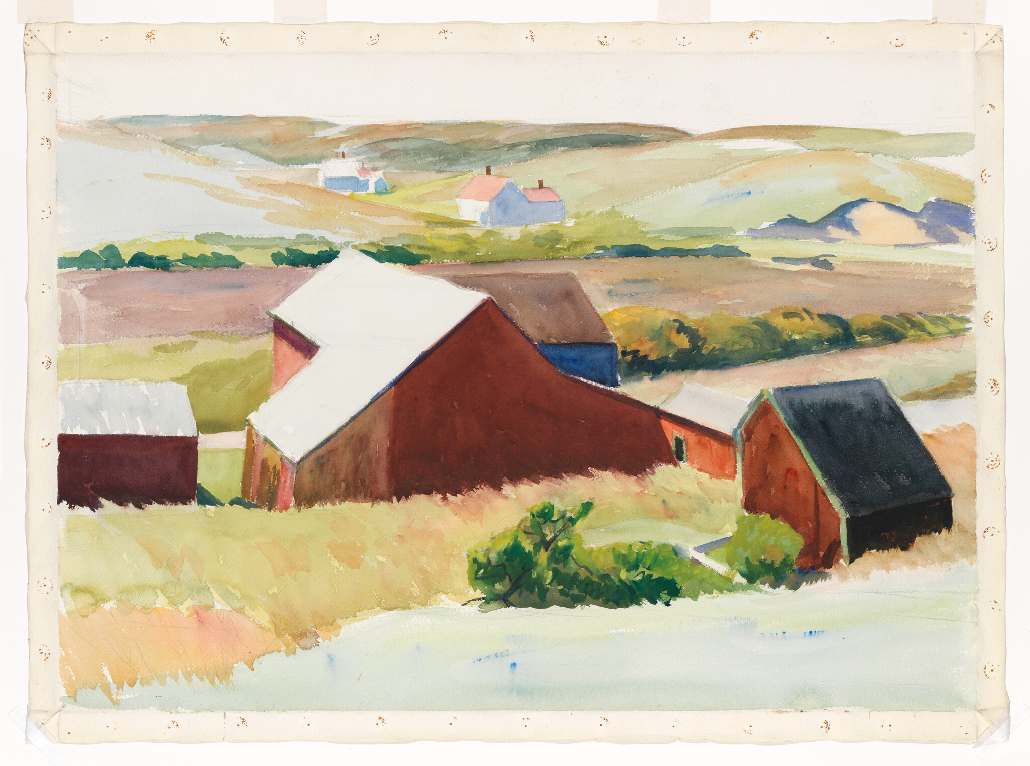 Red barns sit among rolling grassy fields with distant houses under soft hills.