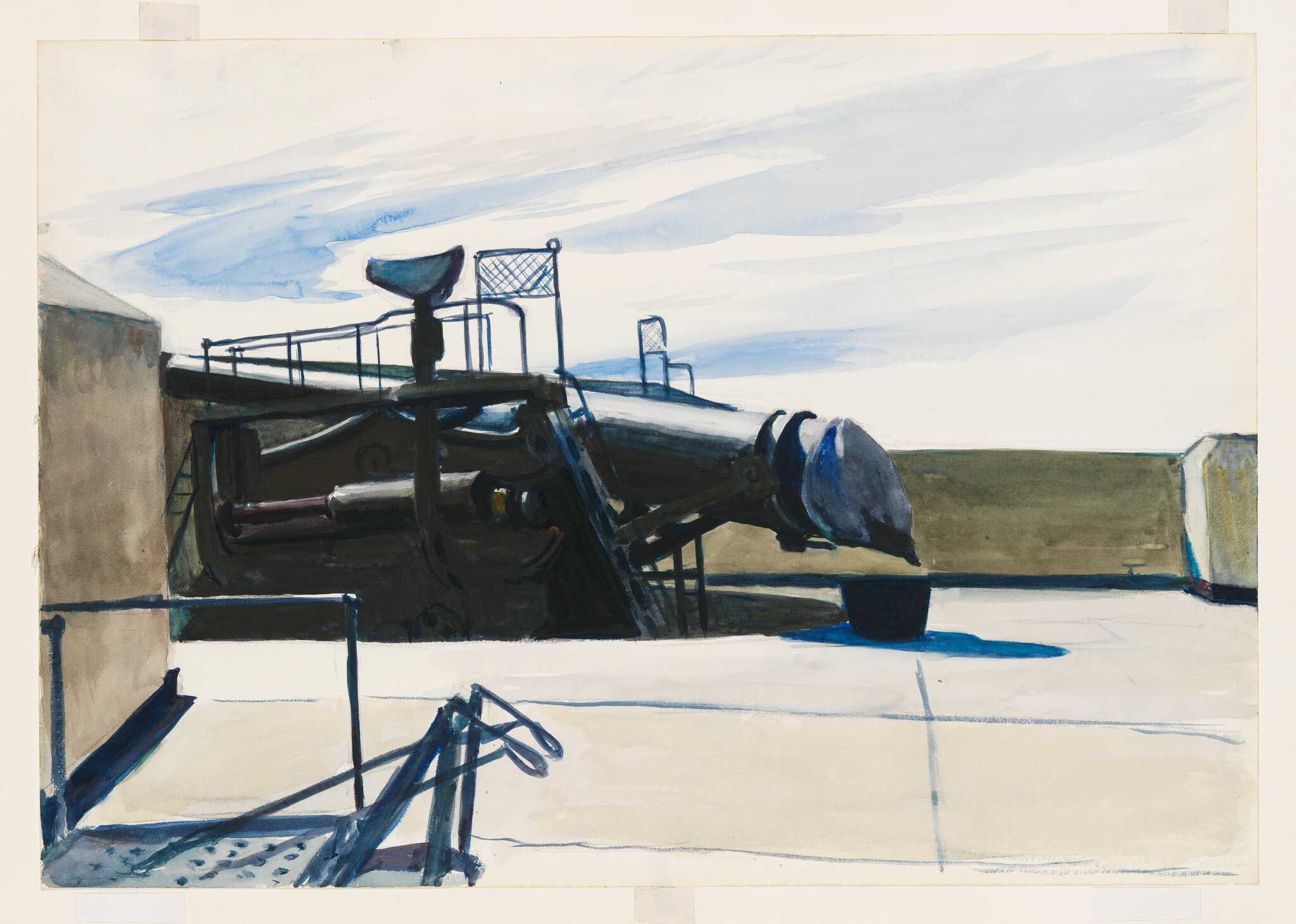 A large naval gun turret sits on a flat concrete platform under a pale cloudy sky.