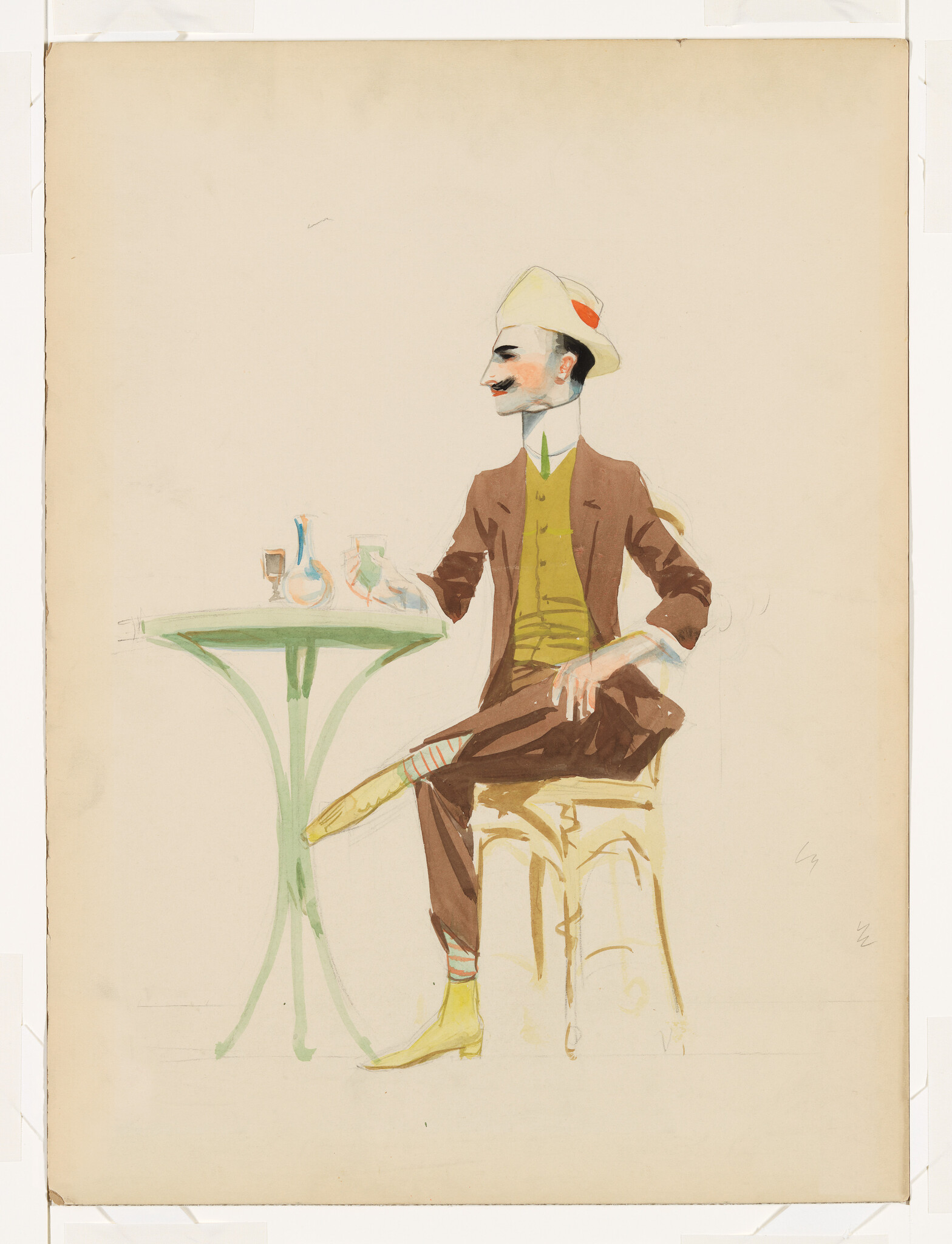 A man with a mustache sits at a small table holding a glass and umbrella across his lap.
