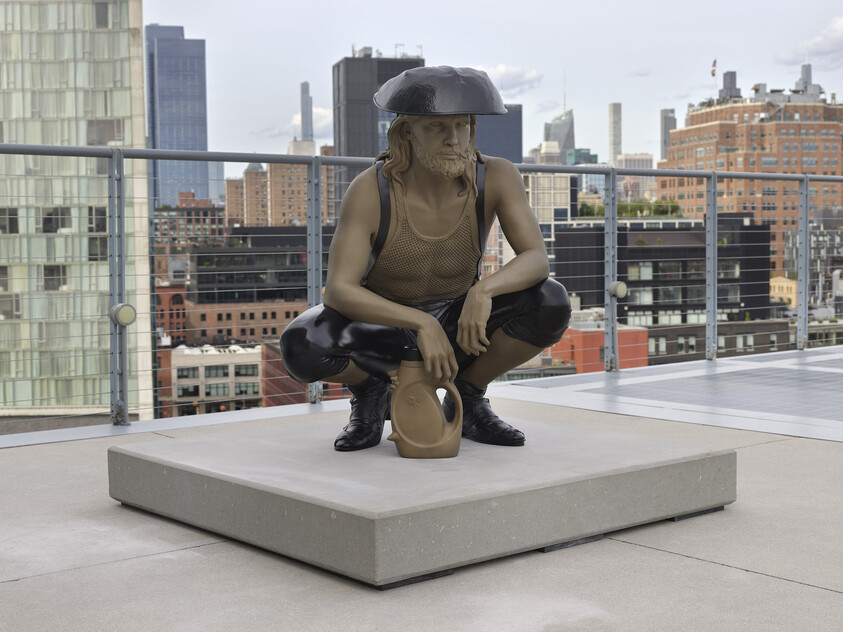 A person wearing a bowl-like hat squats holding a tan jug while wearing a sleeveless top and boots.