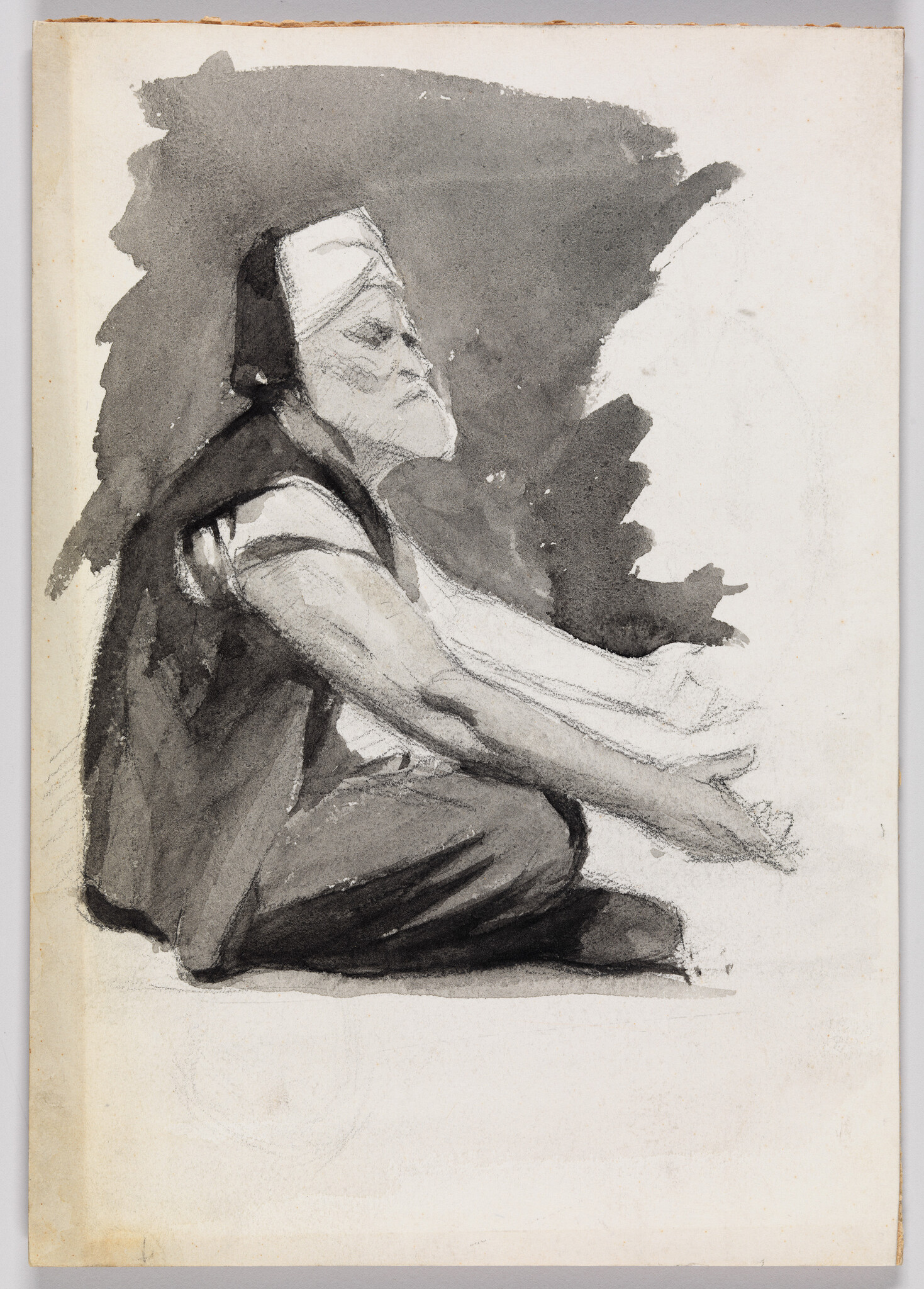 An elderly bearded man sits cross-legged with arms extended forward, gazing slightly upward.