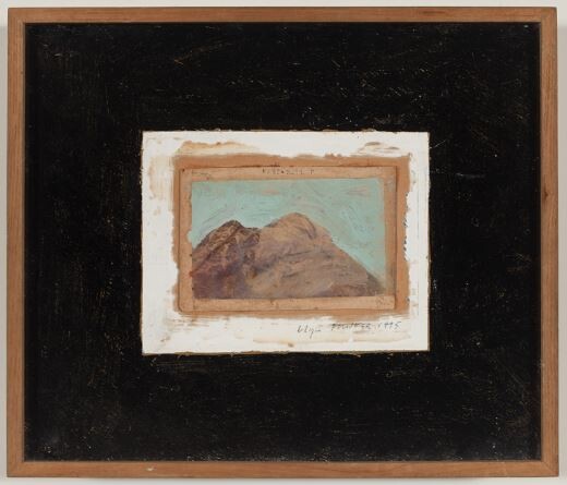 Small vintage painting of two brown mountains on a pale blue sky mounted in a black wooden frame.