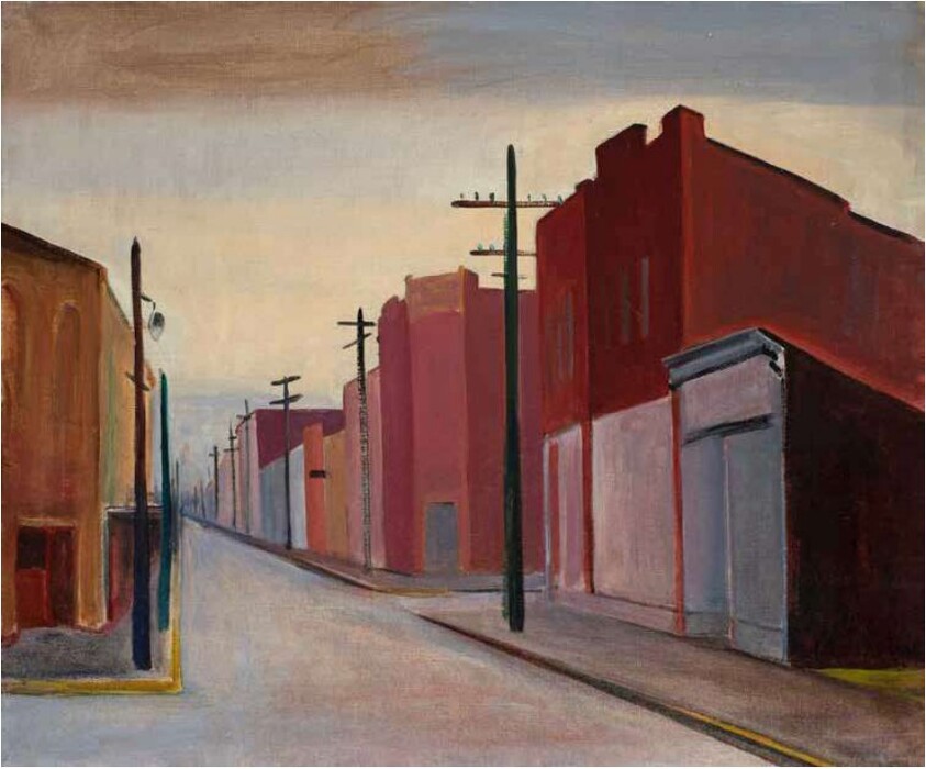 An empty city street lined with red brick buildings and tall utility poles at dawn.