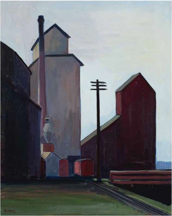 Tall grain elevators and dark industrial buildings beside railroad tracks under a pale sky.