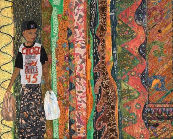 Young person wearing a Chicago Bulls 45 shirt holds two shopping bags next to colorful patterned textiles.