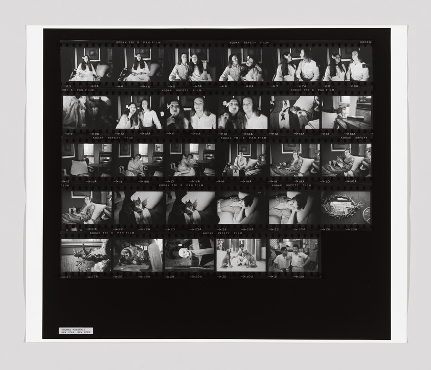 Black-and-white contact sheet showing multiple small photographs of people sitting, talking, and posing.