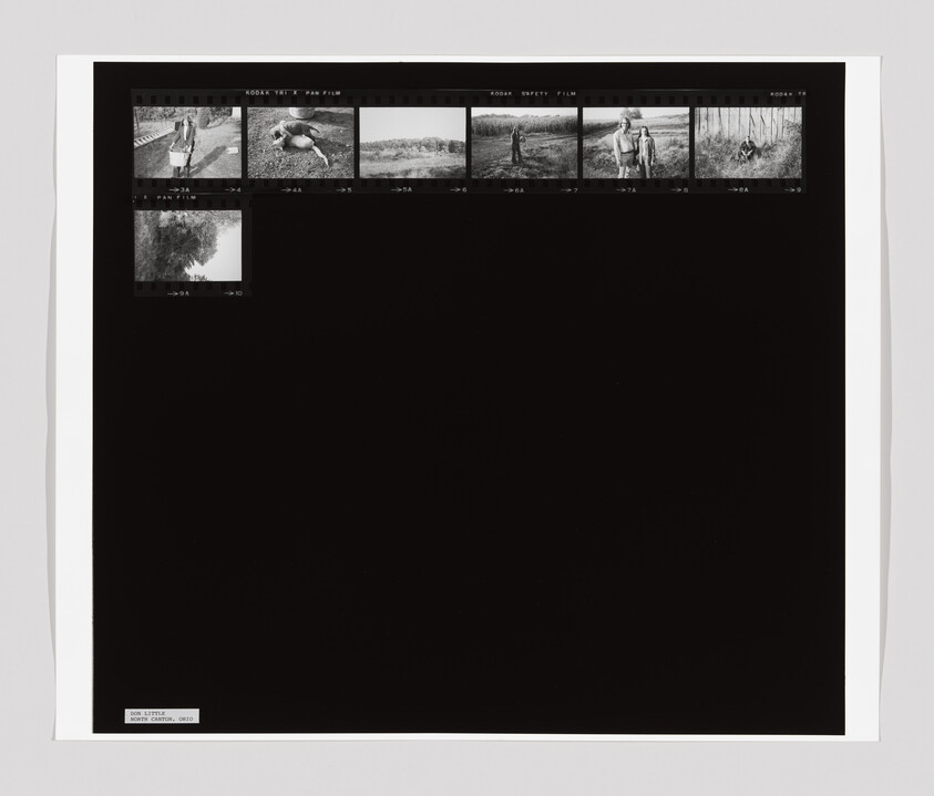 A contact sheet with six small black-and-white photos of people and a dog outdoors, mostly in grassy areas.