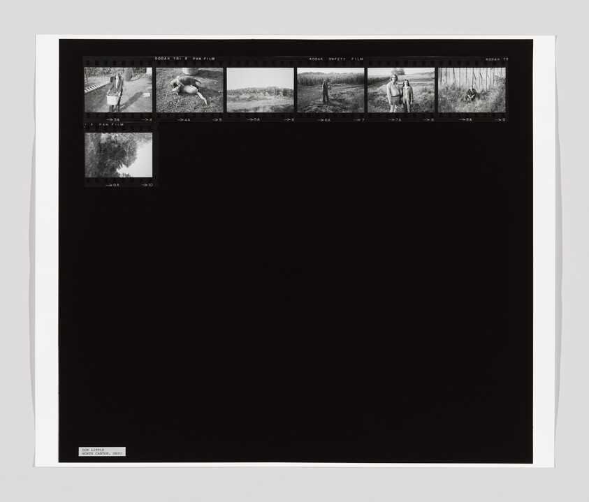 Black contact sheet showing seven small black-and-white film frames along the top edge.
