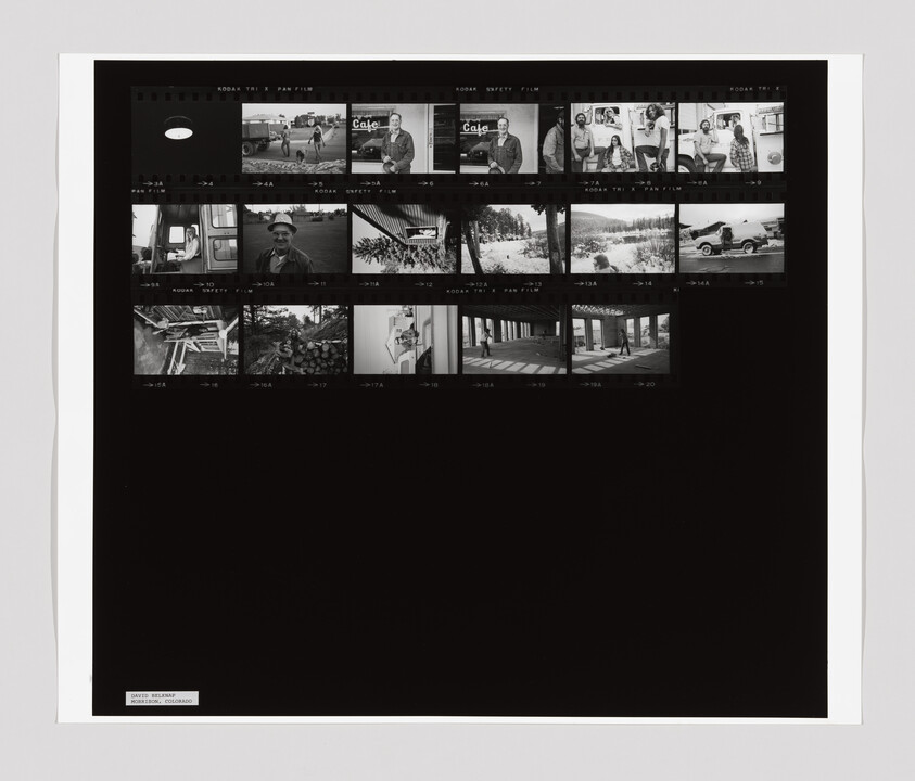 A contact sheet with black-and-white photos showing people, a café sign, vehicles, and outdoor scenes.
