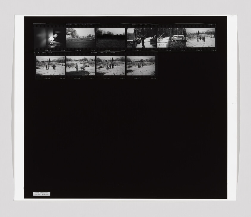 Contact sheet showing small black-and-white frames of people and cars in a snowy landscape.