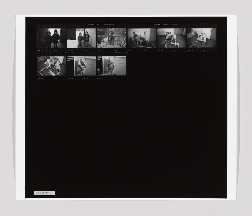 A contact sheet with small black-and-white photos of two children playing and standing outside in winter clothes.