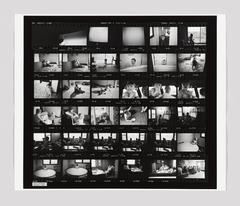 Black-and-white contact sheet showing multiple small film frames of family scenes, children, and interiors.