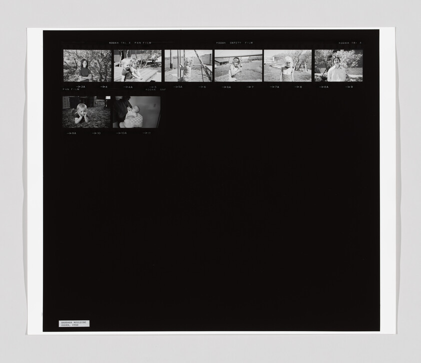 A contact sheet with small black and white photos of people outdoors and a child with an adult.