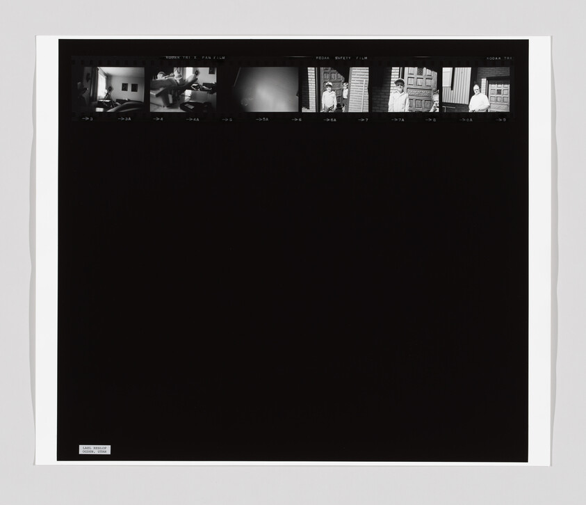 Six small black-and-white film frames at the top show people indoors and outdoors, with most of the image black.