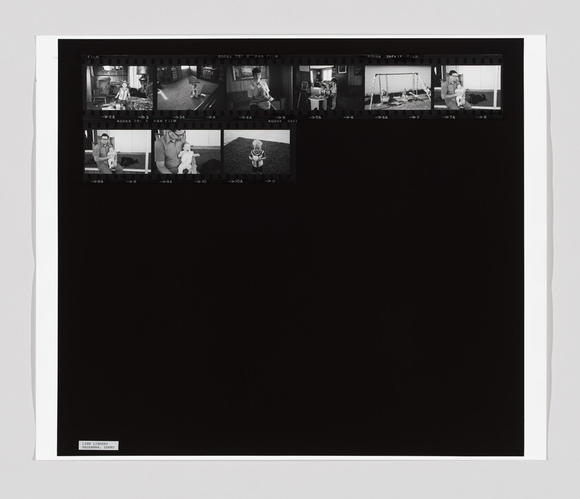 Contact sheet of black-and-white film negatives showing a child and an adult in home and playground scenes.