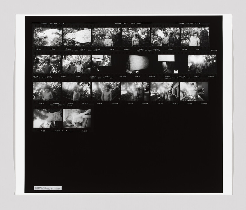 A contact sheet with black and white photos of children outdoors, some standing, some lying down, and a car.