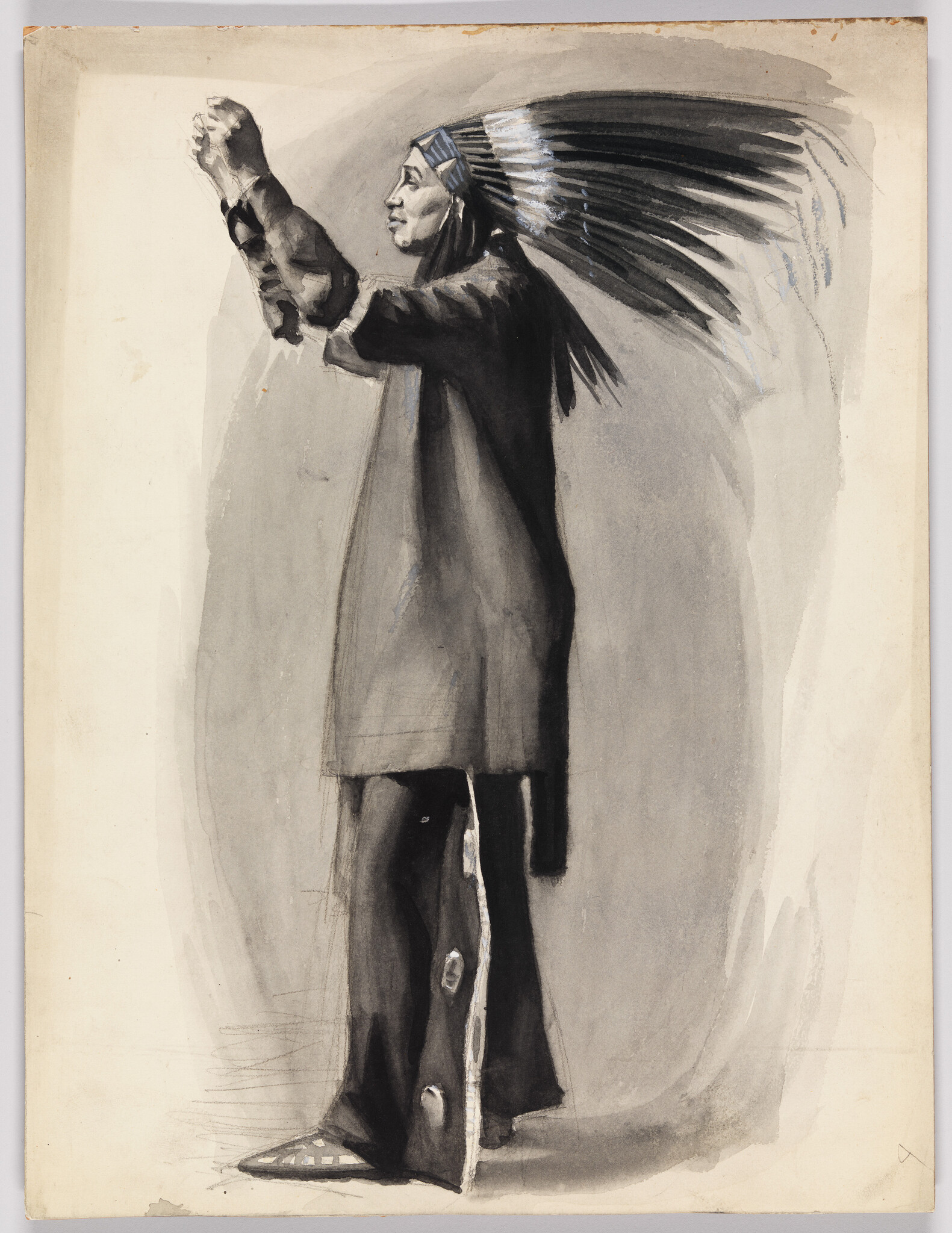 A man wearing a feathered headdress raises both hands upward as if performing a ritual.