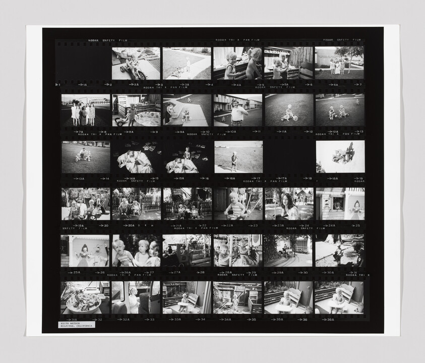 A contact sheet with multiple black-and-white photos showing children playing, riding bikes, and spending time outdoors and indoors.