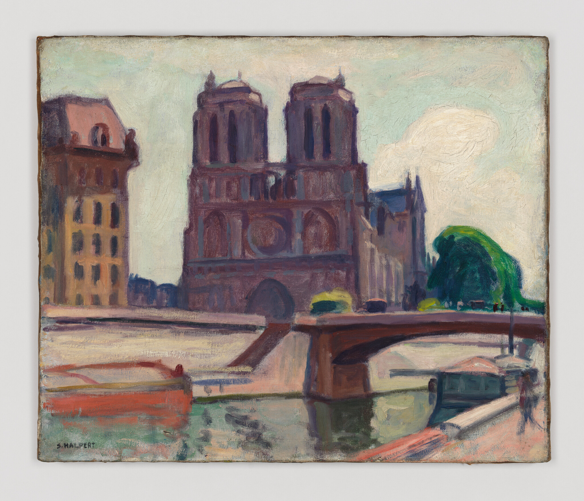Notre-Dame cathedral stands behind a bridge with boats on the Seine under a pale sky.